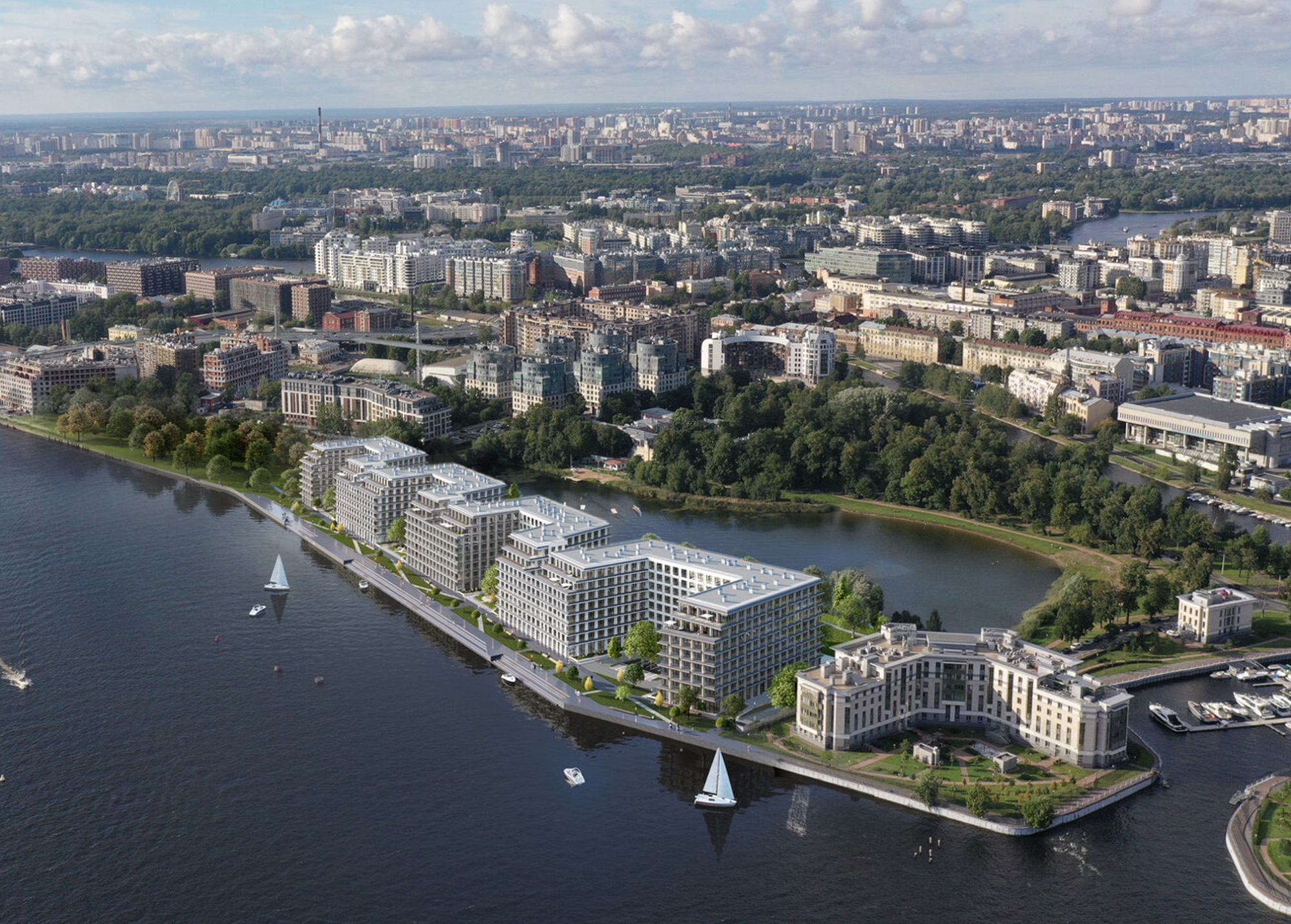 Комплекс с высоты: светлые корпуса вдоль излучины реки, парусники на воде, зелёный остров